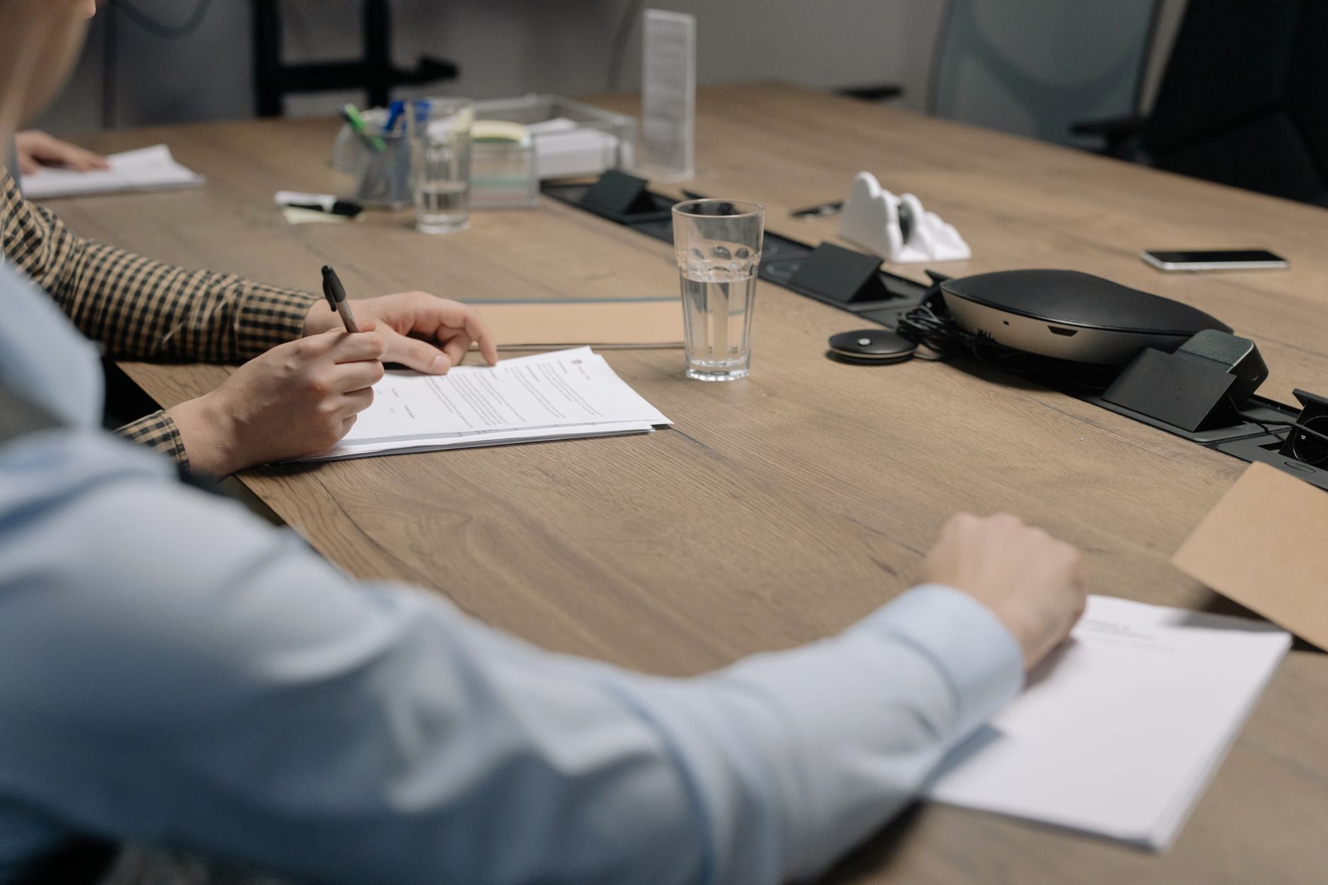 Reviewing and signing financing terms at a lender meeting