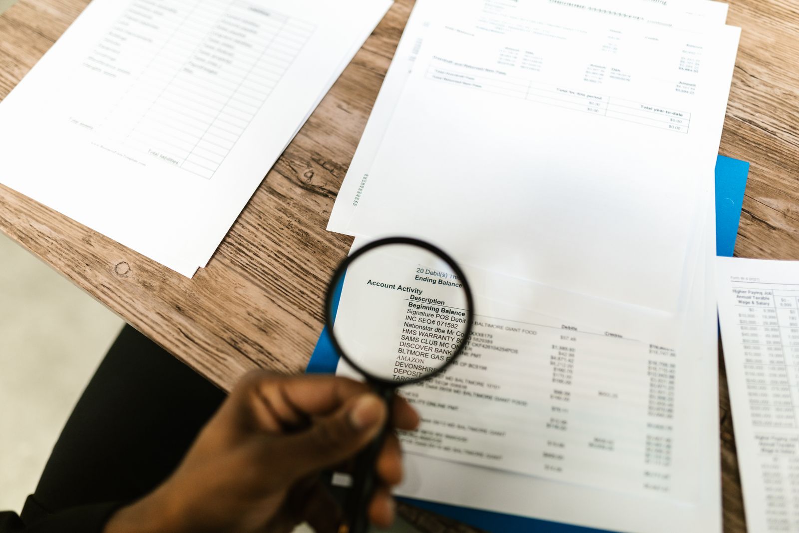 A magnifying glass over a financial statement, reading the fine print of covenant defaults