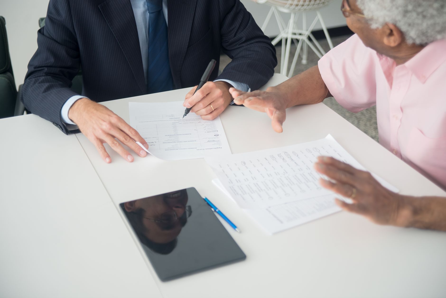 A founder and lender reviewing a venture debt term sheet to set the interest-only period