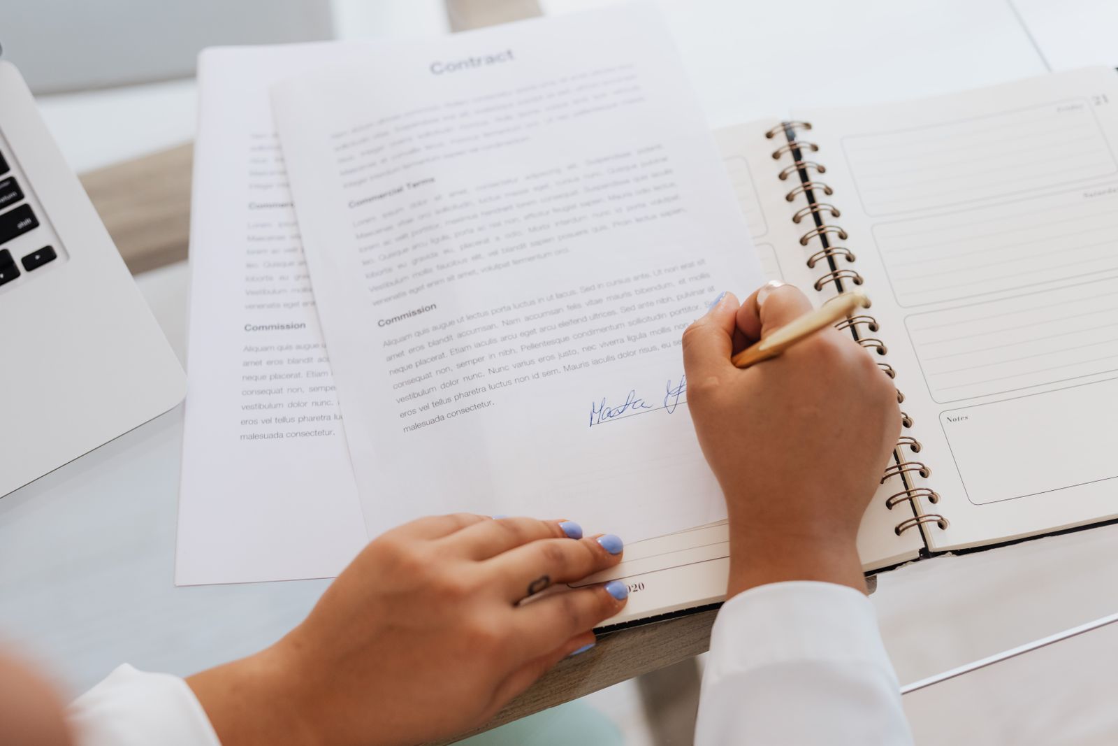 Founder comparing revenue-based financing term sheets before signing