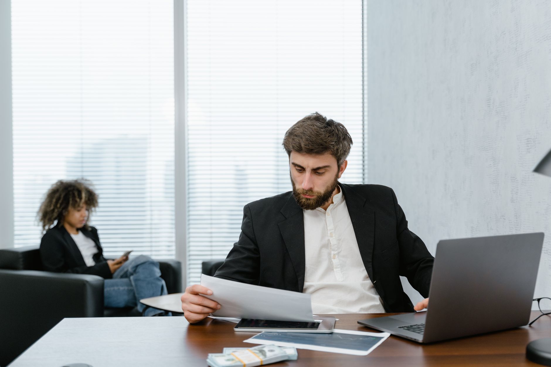 A founder reviewing financial reports before applying for venture debt
