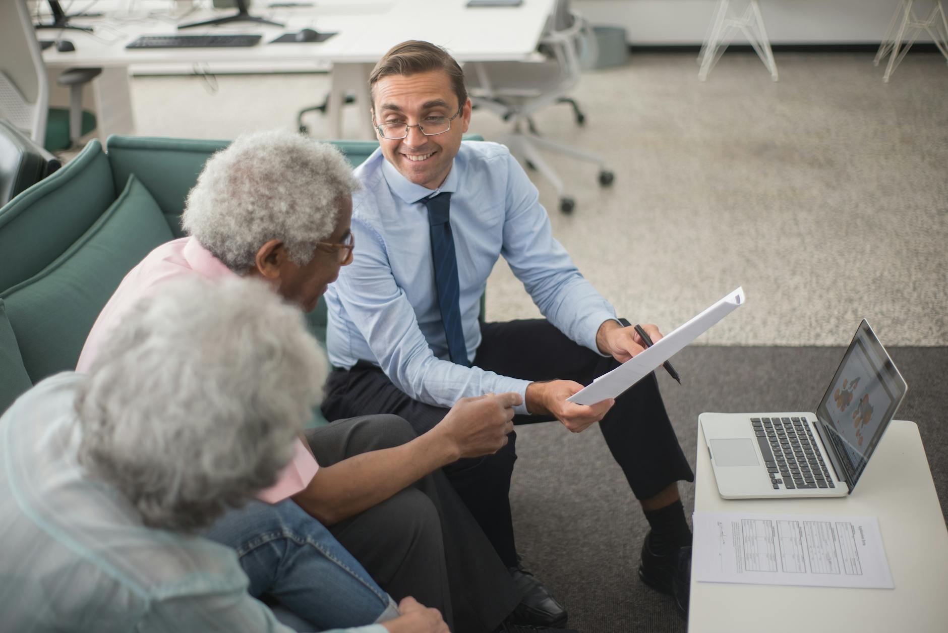 A financial advisor reviewing plans with clients, the kind of guidance behind customer value finance